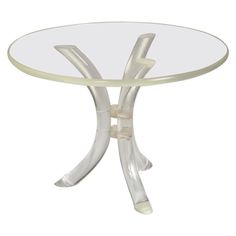 a glass table with metal legs and an oval top, on a white background photo