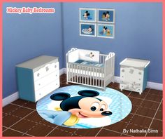 a mickey mouse nursery room with blue walls and white furniture, including a baby crib