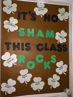 a bulletin board that says it's no sham this class rocks with shamrocks