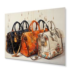 four purses are lined up against a wall