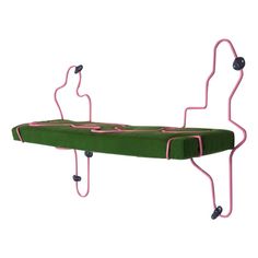 a green bench with pink handles and wheels