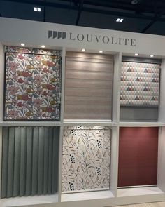 several different types of blinds on display at a showroom with the words louvoite written above them