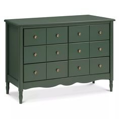 a green dresser with many drawers and knobs on the top, in front of a white background