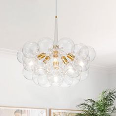 a chandelier hanging from the ceiling in a living room