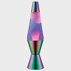 a multicolored glass vase sitting on top of a table