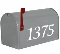 a gray mailbox with white numbers on it