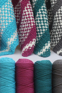 several skeins of yarn lined up in rows