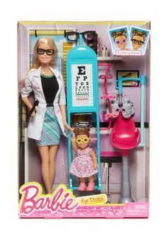 the barbie doll is in her dressing room and has an eye test set on display