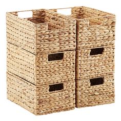 three woven storage baskets with handles are stacked on top of each other and one is empty