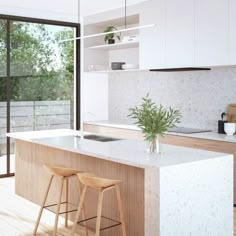 a kitchen with two stools in front of the counter and an open window to the outside