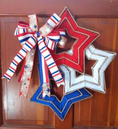 red, white and blue star decorations hang on the front door