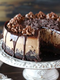 a chocolate cheesecake with one slice missing from it