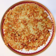 a cheese pizza on a red and white plate