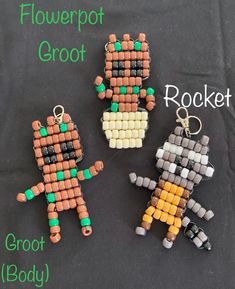 three different types of beaded keychains on a black surface with the words flowerpot groot, rocket and croct