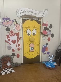 the door to an office decorated with cartoon characters