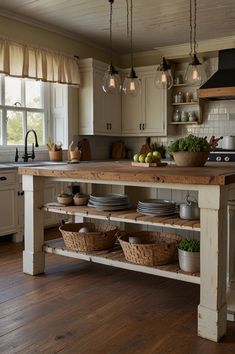 a kitchen island with baskets on it in front of a stove top oven and sink