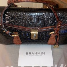 Brahmin Hand Bag. Cognac And Black With Strap. Medium Size Purse. Only Carry It Once. Like Brand New. Come With The Paperwork To Be Mailed In With Price On The Paperwork. Brahmin Bag Come With The Purse. Brahmin Bag, Brahmin Bags, Chic Bags, A Bag, Hand Bag, Cognac, Medium Size, Fashion Bags, Black Color