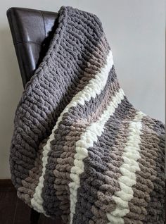 a chair that has a blanket on it