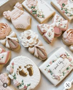 decorated cookies are displayed in a box on the table for someone's special occasion