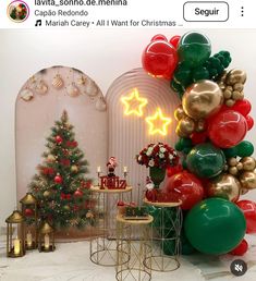 an image of christmas decorations on display in front of a wall with lights and balloons