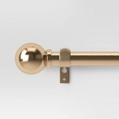 an image of a gold door handle on a white background