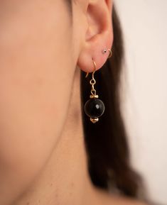 * Golden stainless steel hook * Pearl pendant ⚫ Golden Stainless Steel Earrings with Black Pearl ⚫ Add a touch of delicacy and elegance to your style with our black pearl earrings. ☀️ Radiant Style: These black pearl earrings will complement all your outfits. They are lightweight and comfortable to wear all day. Pair them with the matching necklace for a complete celestial look: (https://atelierreinette.etsy.com/listing/1612440286) ☀️ Ideal Gift: These celestial earrings make a perfect gift for your loved ones. Whether for a birthday, Christmas, or a celebration, you're sure to please. 💌 Free Shipping Minimalist Earrings | Golden Stainless Steel | Pearl Pendant | Pearl Earrings | Everyday Jewelry | Luminous Accessory | Modern Style | Elegant Gift | Sophisticated Look | Versatile Jewelry | Artistic Earrings, Black Pearl Earrings, Feminine Jewelry, Sophisticated Jewelry, Celestial Earrings, Earrings Golden, Earrings Everyday, Bohemian Accessories, Boho Chic Jewelry