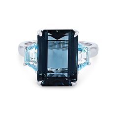 Modern Rectangular Blue Topaz Ring, Modern Blue Radiant Cut Rings, Blue Square Cut Topaz Ring, Blue Topaz Ring With Square Cut, Blue Rectangular Topaz Ring With Accent Stones, Rectangular Blue Topaz Ring With Accent Stones, Blue Topaz Ring With Square Cut Gemstone, Blue Topaz Ring With Accent Stones, Rectangular Shape, Blue Radiant Cut Topaz Ring Fine Jewelry