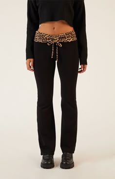 Unleash your wild side with the Leopard Print Fold-Over Flare Pants from PacSun, boasting a fierce leopard print fold-over waistband for an eye-catching touch. With a flattering low-rise fit, cinched front detail, and flared leg openings, they're the perfect blend of edgy style and comfortable chic for any occasion.8.75" rise31.5" inseamLow-riseFold-over waistbandCinched front detailFlared leg openingsTight fitSELF 95% COTTON 5% SPANDEX CONTRAST: 80% POLYESTER 16% RAYON 4% SPANDEXModel is wearin Lounge Fits, Fly Outfit, Comfortable Chic, Wardrobe Clothes, Basic Fits, The Leopard, Edgy Style, Flare Leggings, Lookbook Outfits