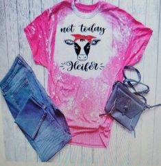 a pink shirt with the words not today water on it, and some denim shorts