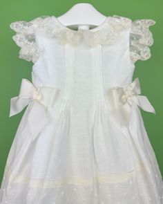 Made in Spain Dry Clean 50% Cotton, 50% Polyester Final sale, no exchanges nor returns are available Classic White Dress For Formal Occasions, Off White Lace Trim Dress For Garden Party, Elegant Cream Baptism Dress For Summer, Elegant Baptism Dress For Spring, Classic White Party Dress, Classic Summer Dresses With Lace Trim, Elegant Off-white Summer Baptism Dress, Elegant Summer Baptism Dress With Ruffles, Elegant Off-white Dress With Lace Trim