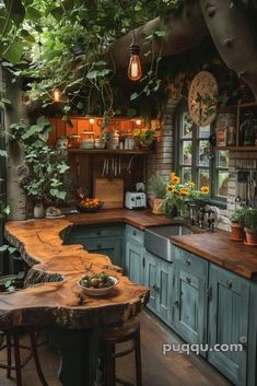 a kitchen with green cabinets and wooden counter tops