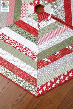 a close up of a quilt on the floor