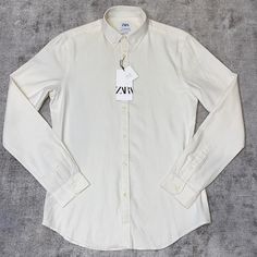 Off White Color Classic Zara Button-up Shirt, Zara Classic Button-up Shirt, Classic Off White Long Sleeve Tops, Classic Off-white Long Sleeve Tops, Classic Long Sleeve Off White Tops, White Collared Zara Shirt, Classic Cream Cotton Blouse, White Classic Slim Fit Blouse, Classic White Slim Fit Blouse