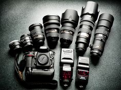 many different types of cameras sitting on the ground