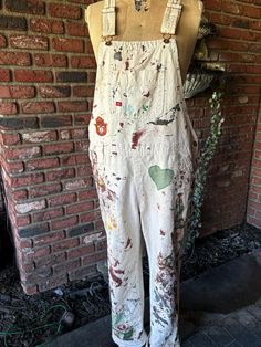 Gear up for fall in hand-painted Dickies overalls with plaid and floral patchwork, topped off with a Smokey the Bear patch 🐻🍁 Rugged, unique, and made to stand out--whether you're on the go or on the job.  Size large flat measurement waist 20"  inseam 29" White Paint Splattered Overalls, Womens Painting Overalls, Crust Overalls, Painter Overalls, Painted Overalls, Painters Overalls, Plaid And Floral, Dickies Overalls, Smokey The Bear