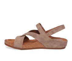 Synthetic upper, Secure Velcro strap closure, Approx. 1 1/4 inch wedge heel height, Classic rounded open toe, Cushioned footbed for added comfort, Cork midsole, Durable outsole, Smooth shoe lining, Unique toe loop, Eurosoft branding details | Women's EuroSoft Gianetta Sandals in Stone Taupe Size 6 Footbed Sandals, Shoe Carnival, Womens Sandals Flat, Comfortable Sandals, Velcro Straps, Hook And Loop, Ankle Strap Sandals, Strap Sandals, Flat Sandals