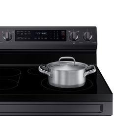 a black stove top with a pot on it