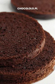 two chocolate cakes sitting on top of each other