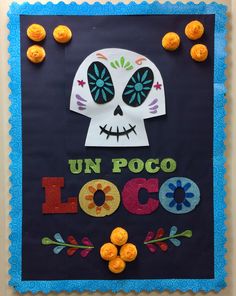 a decorated sign that says un poco locoo with sugar skulls and flowers on it