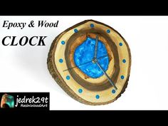 a clock made out of wood with blue paint on it's face and the words, easy & wood clock