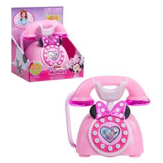 Call a friend for a great chat on the Disney Junior Minnie Mouse Ring Me Rotary Phone. This delightful kids’ toy is full of roleplay fun. It looks just like the phone Minnie Mouse uses on the Disney Junior animated hit, Minnie’s Bow-Toons. With stylish details, this retro-inspired pretend play phone features a super luxe, iridescent pink finish with chrome-like accents, and buttons that activate lights, fun phone sound effects, and Minnie Mouse phrases. Adorable mouse ears and a polka dot bow ma Toy Telephone, Toy Shopping Cart, Convertible Toddler Bed, Mouse Ring, Play Phone, Disney Cheap, Minnie Mouse Toys, Small Room Ideas, Disney Jr