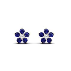 Crafted in 10k yellow gold, each of these stylish flower burst stud earrings features a beautiful combination of one round cut natural diamond and five round cut natural Blue Sapphire gemstones, in a flower like formation. The diamond at the center offers a sharp contrast to the blue sapphire gemstones, with the yellow gold complementing the look. Finished to a bright polished shine, these stud earrings are secured with friction backs. An eye-catching design, this pair of blue sapphire stud earr Blue Sapphire Cluster Earrings For Gift, Elegant Sapphire Flower-shaped Jewelry, Fine Jewelry Sapphire Flower-shaped, Sapphire Diamond-cut Round Earrings, Luxury Multi-stone Sapphire Earrings, Blue Sapphire Studs, Sapphire Earrings Studs, Sapphire Studs, Diamond Flower