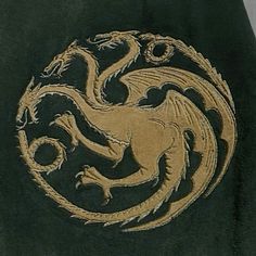 a black jacket with a gold dragon on it