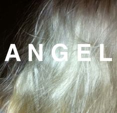 the back of a woman's head with an angel haircut in white text