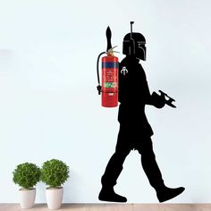 a wall decal depicting a man with a fire extinguisher in his hand