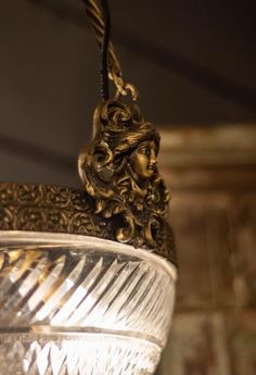 an ornate light fixture hanging from the ceiling