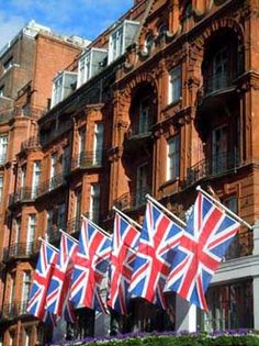 several british flags are in front of a building