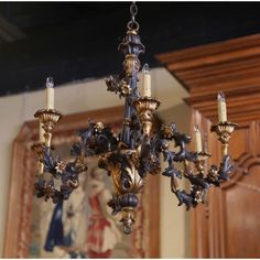 a chandelier hanging from the ceiling in a room