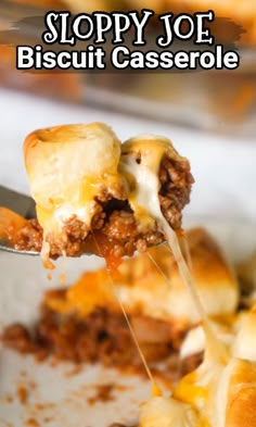 a spoon full of cheesy meat and cheese casserole being lifted from a casserole dish