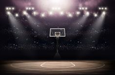 an empty basketball court with spotlights on the sidelines and fans in the stands